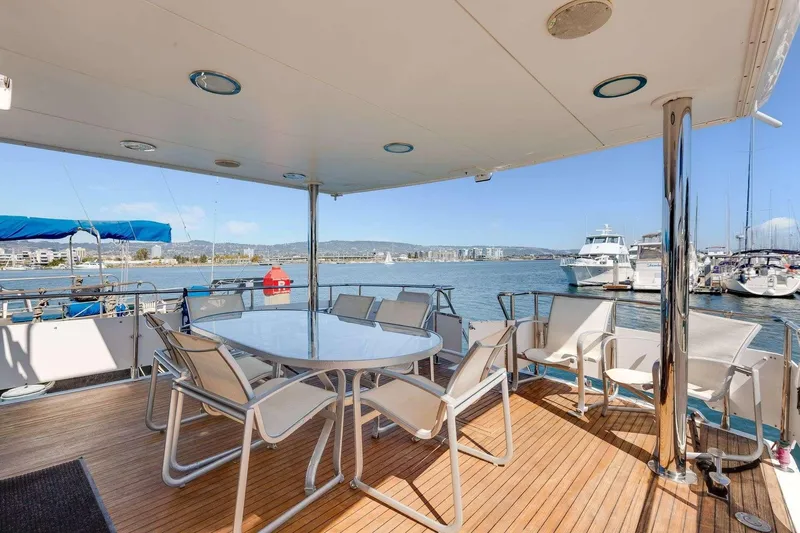 Slide: The Image of Spacious deck of 1988 Azimut Motor Yacht with seating, overlooking marina. - 20