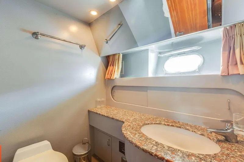 Slide: The Image of Luxurious 1988 Azimut Motor Yacht bathroom with granite countertop and modern fixtures. - 28