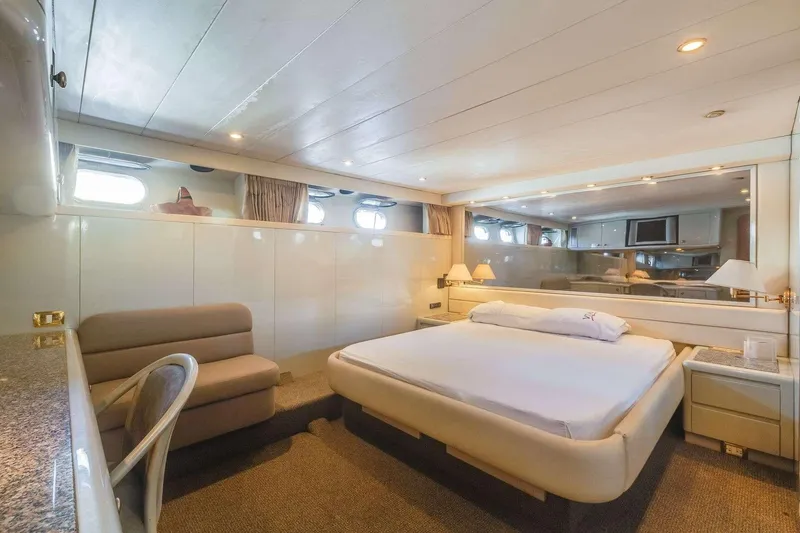 Slide: The Image of Luxurious 1988 Azimut Motor Yacht bedroom with elegant furnishings and ambient lighting. - 40