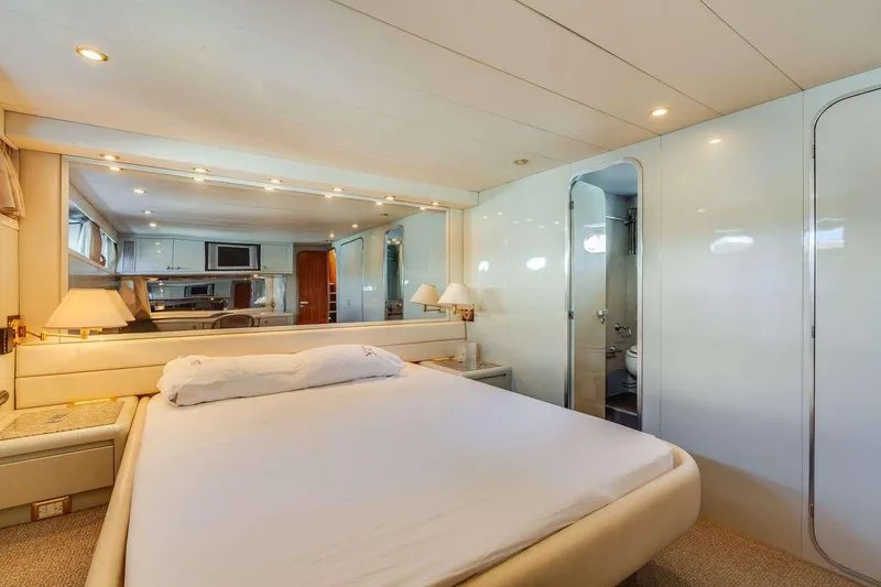 Slide: The Image of Luxurious 1988 Azimut Motor Yacht bedroom with elegant decor and ensuite bathroom. - 41