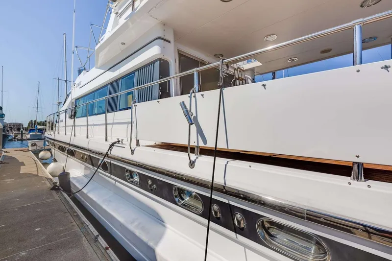 Slide: The Image of 1988 Azimut Motor Yacht docked at marina, showcasing sleek design and polished exterior. - 43