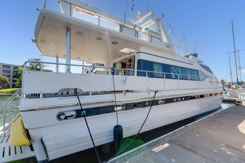 Slide: The Image of 1988 Azimut Motor Yacht docked at marina, side view. - 46