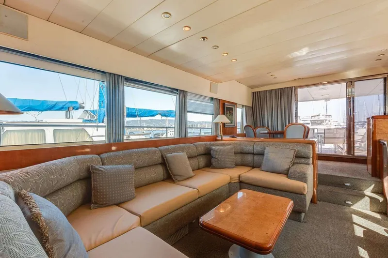 Slide: The Image of Luxurious interior of a 1988 Azimut Motor Yacht with plush seating and elegant decor. - 6