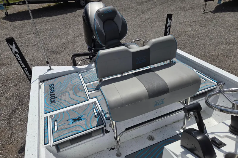Slide: The Image of 2022 Xpress H22B boat interior with seating and storage compartments. - 14