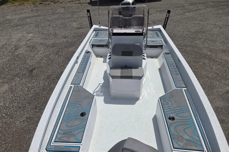 Slide: The Image of 2022 Xpress H22B boat interior with seating and storage compartments, featuring modern design. - 15