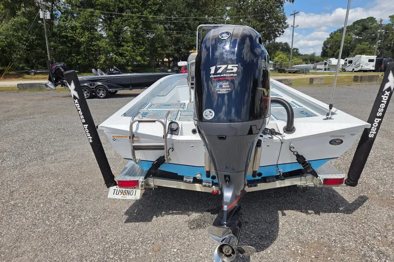Slide: The Image of 2022 Xpress H22B boat with Yamaha 175 engine, parked outdoors. - 6