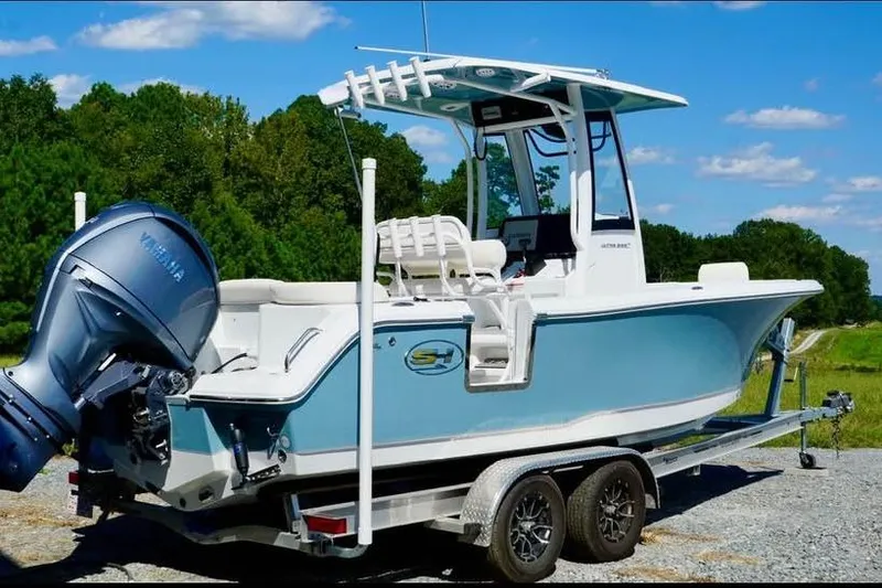 The Image of 2026 Sea Hunt Ultra 235 SE boat on trailer, featuring Yamaha outboard motor. - 0