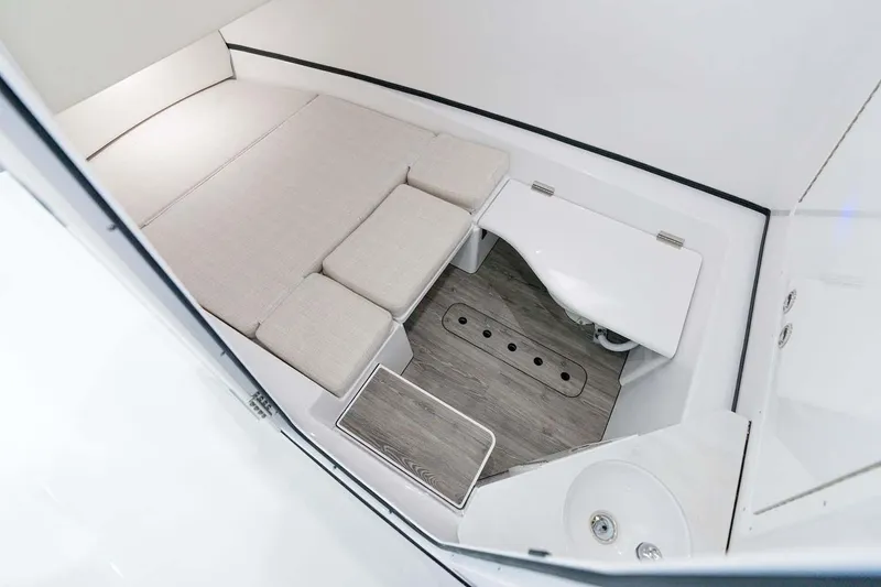 Slide: The Image of Manufacturer Provided Image: 2022 Sportsman Open 352 Center Console cabin interior with seating and sink. - 21