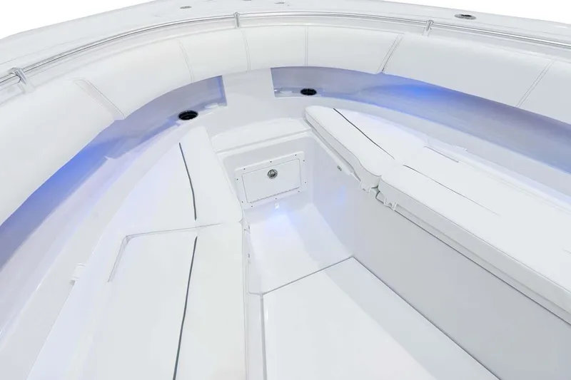 Slide: The Image of Manufacturer Provided Image: 2022 Sportsman Open 352 Center Console boat interior with white seating and blue LED lighting. - 5