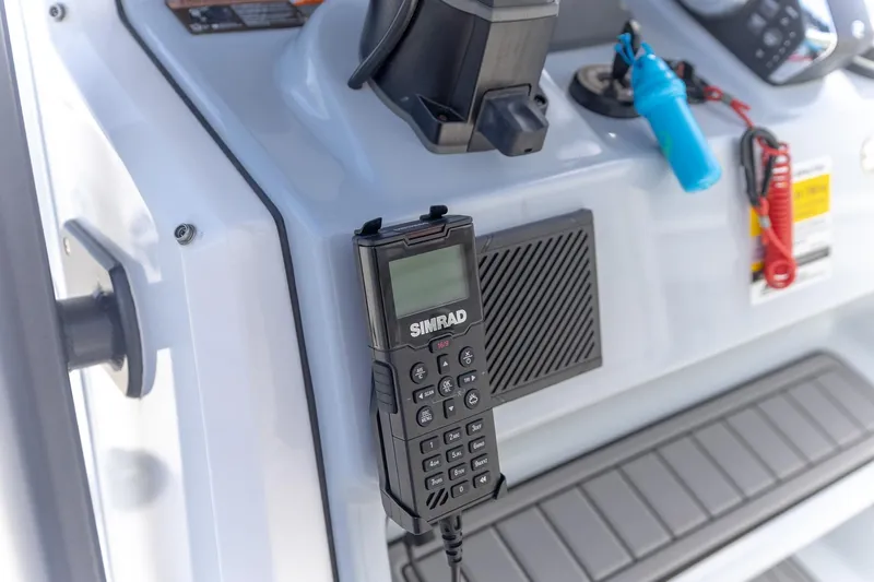 Slide: The Image of Simrad radio on 2024 Crevalle 26 HCO boat console, featuring modern marine equipment. - 19