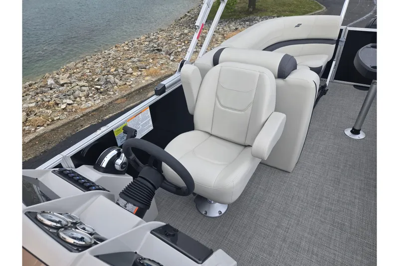 Slide: The Image of 2023 Starcraft EX 22 R boat interior with plush seating and modern controls. - 12