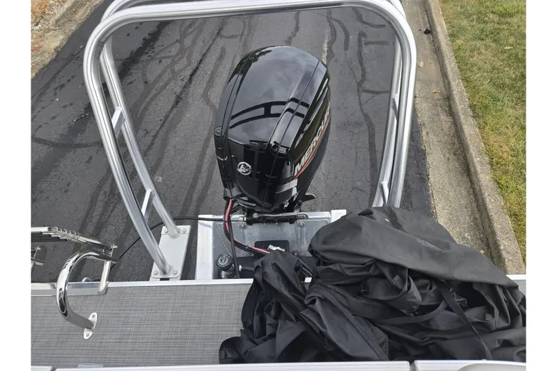 Slide: The Image of 2023 Starcraft EX 22 R boat with Mercury outboard motor on a trailer. - 15