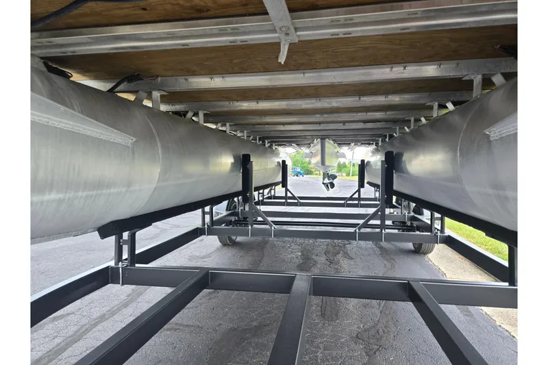 Slide: The Image of Underneath view of 2023 Starcraft EX 22 R pontoon boat on trailer. - 20