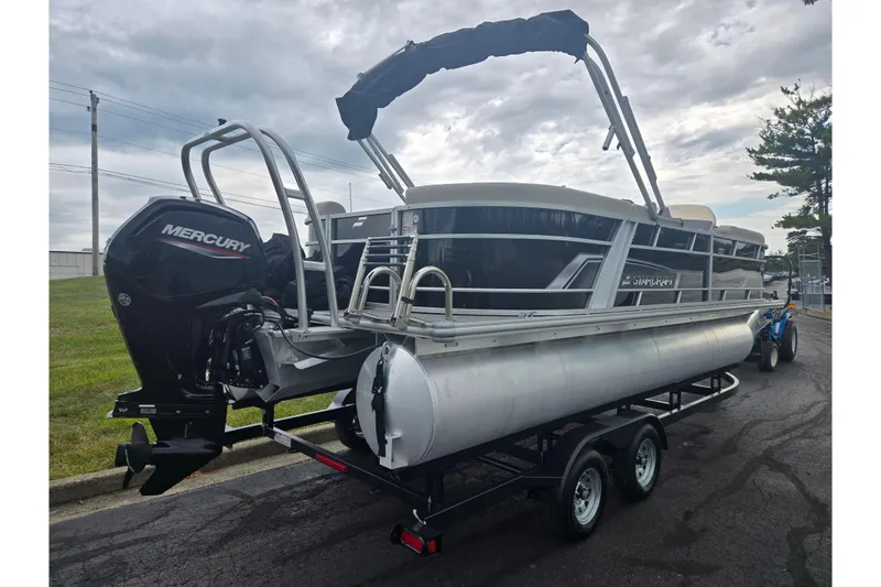 Slide: The Image of 2023 Starcraft EX 22 R pontoon boat on trailer with Mercury outboard motor. - 3