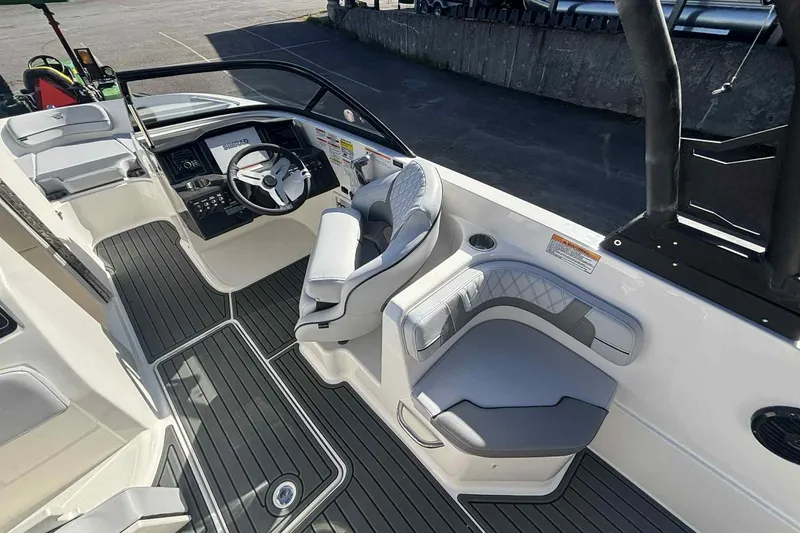 Slide: The Image of 2026 Bayliner VR6 Bowrider I/O interior with modern helm and seating. - 4