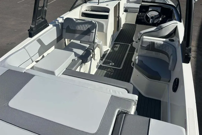 Slide: The Image of 2026 Bayliner VR6 Bowrider I/O interior with modern seating and sleek design. - 6