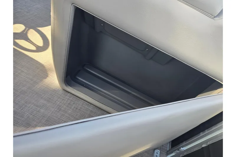 Slide: The Image of 2024 Sun Tracker Party Barge 20 DLX interior storage compartment detail. - 14