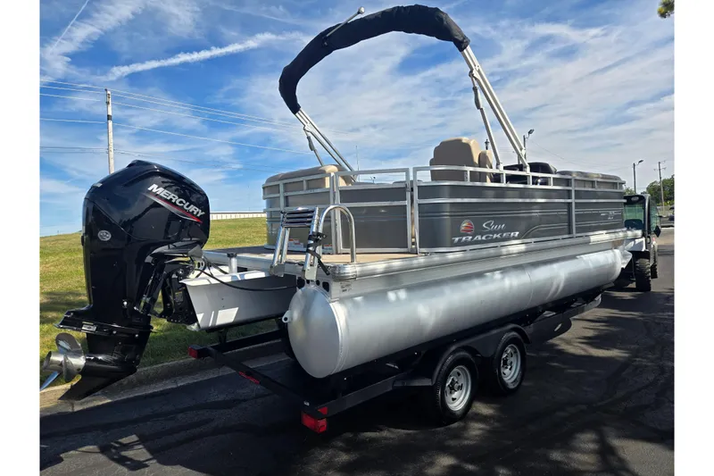 Slide: The Image of 2024 Sun Tracker Party Barge 20 DLX pontoon boat with Mercury outboard motor. - 3