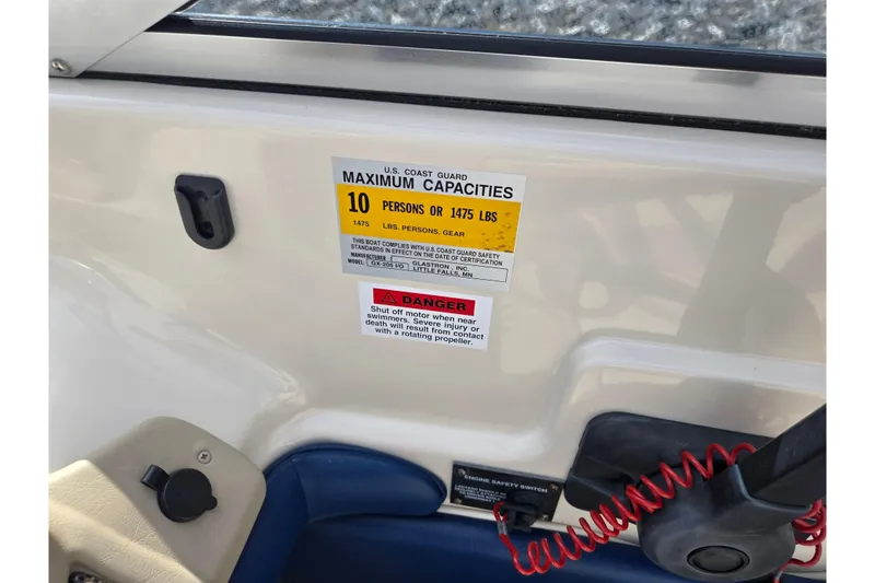 Slide: The Image of 2001 Glastron GX 205 boat capacity label, maximum 10 persons or 1475 lbs. - 13