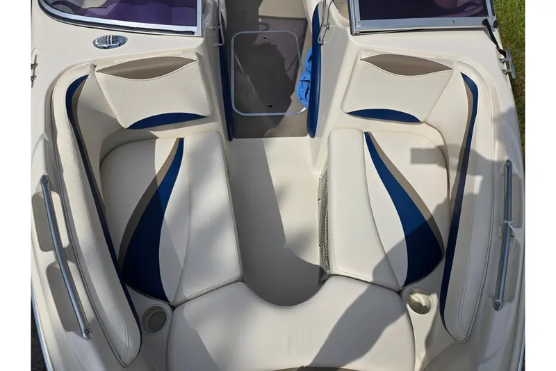 Slide: The Image of 2001 Glastron GX 205 boat interior with white and blue seating design. - 16