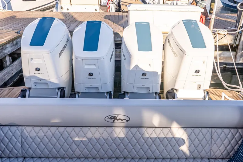 Slide: The Image of 2026 Valhalla V-55 Sport Yacht with four Mercury Verado outboard engines at dock. - 11