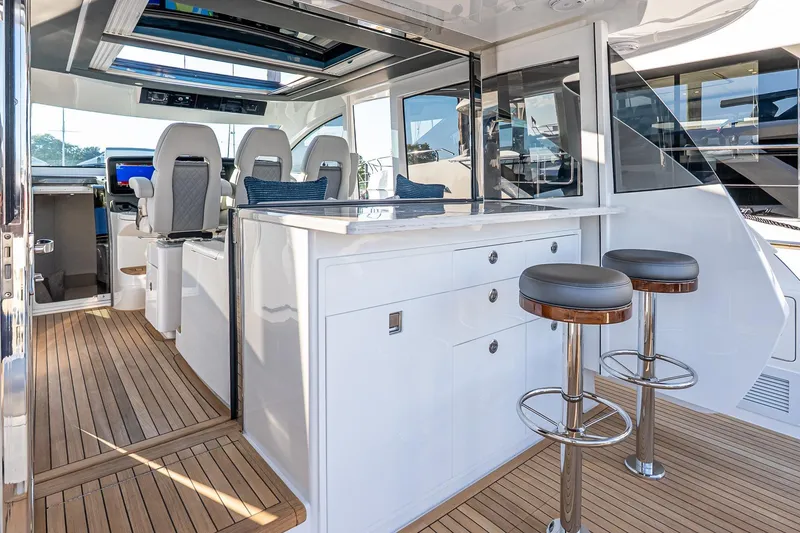 Slide: The Image of 2026 Valhalla V-55 Sport Yacht interior with sleek seating and modern design. - 15