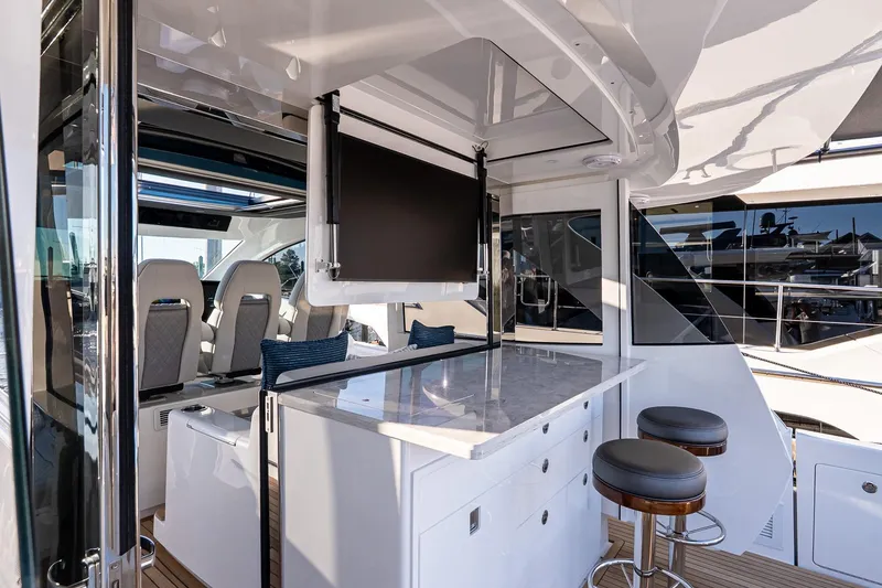 Slide: The Image of Luxurious interior of 2026 Valhalla V-55 Sport Yacht with modern seating and entertainment area. - 16