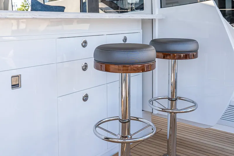 Slide: The Image of Luxury bar stools on 2026 Valhalla V-55 Sport Yacht deck, featuring sleek design. - 18