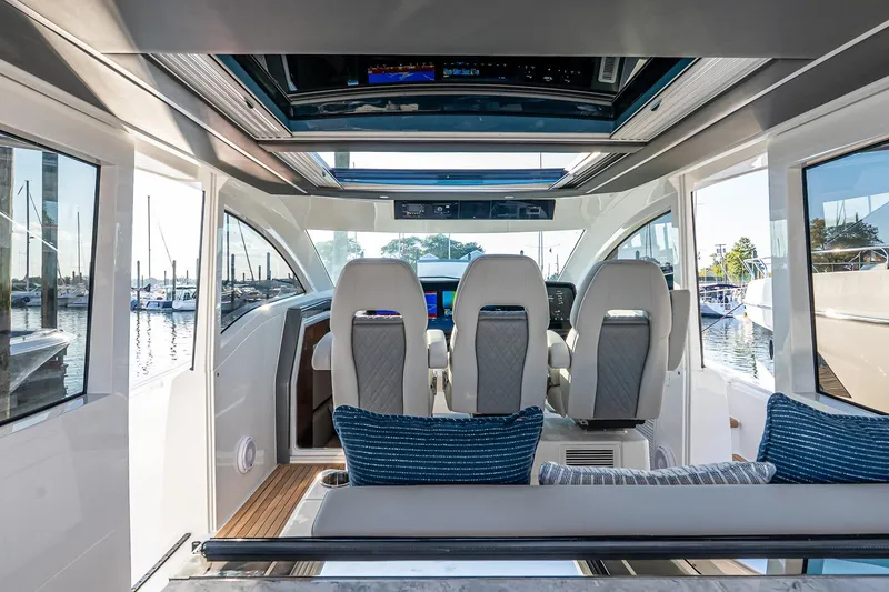 Slide: The Image of Interior of 2026 Valhalla V-55 Sport Yacht with modern seating and panoramic windows. - 20