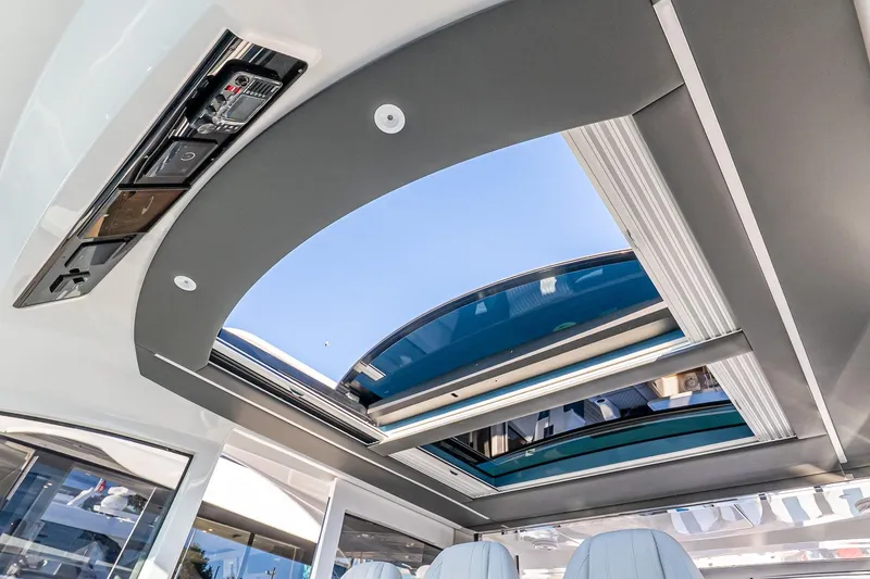 Slide: The Image of 2026 Valhalla V-55 Sport Yacht interior with open sunroof, showcasing modern design. - 21