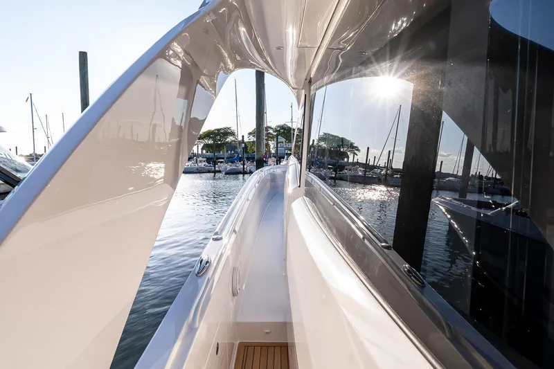 Slide: The Image of 2026 Valhalla V-55 Sport Yacht docked, showcasing sleek design and marina view. - 22