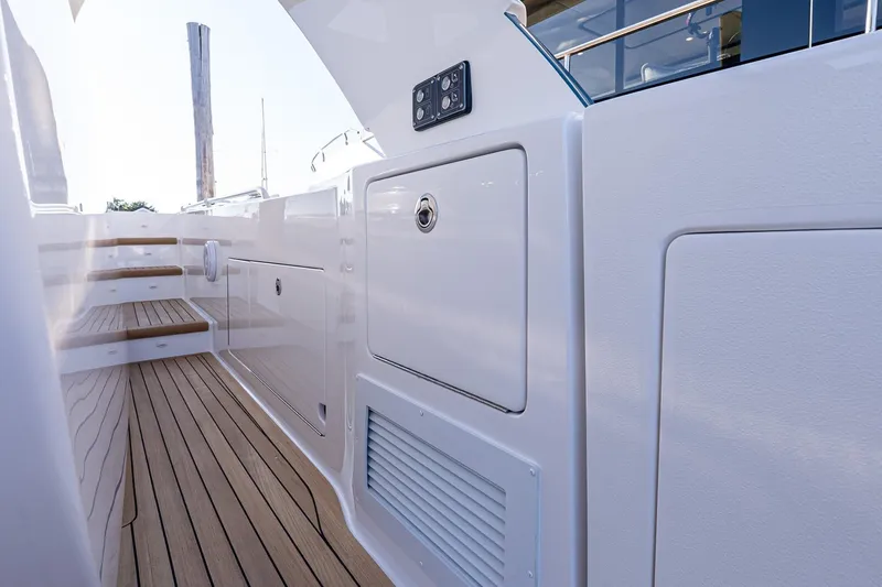 Slide: The Image of 2026 Valhalla V-55 Sport Yacht deck with sleek design and wooden steps. - 25