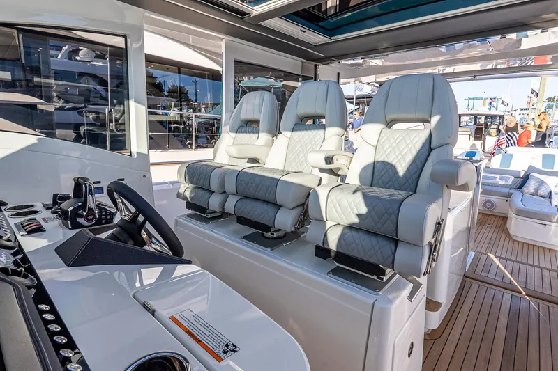 Slide: The Image of Interior of 2026 Valhalla V-55 Sport Yacht with luxurious seating and modern controls. - 27