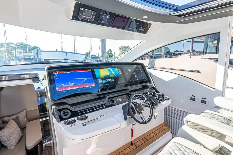 Slide: The Image of 2026 Valhalla V-55 Sport Yacht helm with advanced navigation displays and luxurious seating. - 28