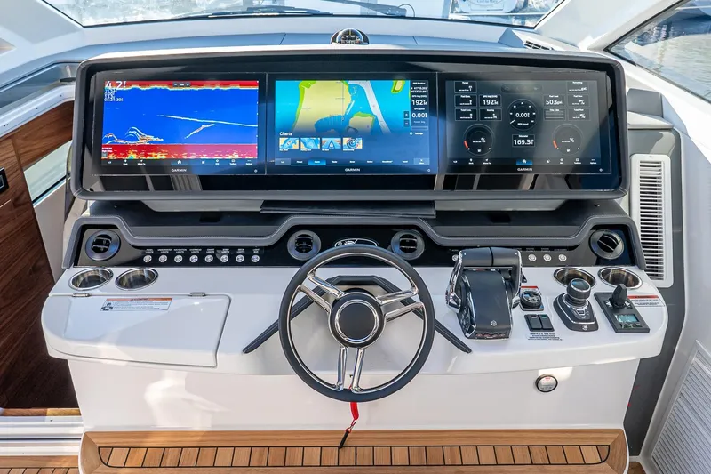 Slide: The Image of 2026 Valhalla V-55 Sport Yacht helm with advanced navigation displays and controls. - 29