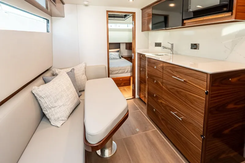 Slide: The Image of Luxurious interior of 2026 Valhalla V-55 Sport Yacht with modern kitchen and seating area. - 31