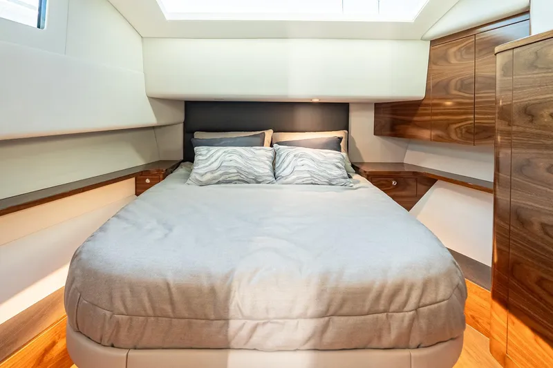 Slide: The Image of Luxurious bedroom interior of 2026 Valhalla V-55 Sport Yacht with modern wood cabinetry. - 32