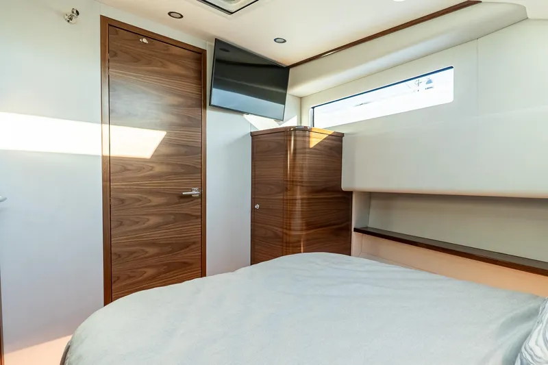 Slide: The Image of Interior cabin of 2026 Valhalla V-55 Sport Yacht with wood accents and modern design. - 33