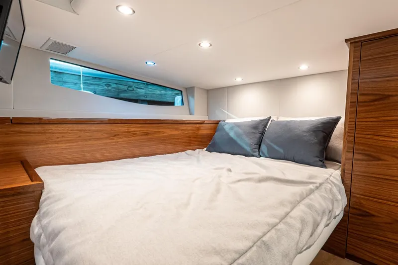 Slide: The Image of Luxurious cabin interior of 2026 Valhalla V-55 Sport Yacht with cozy bedding. - 35