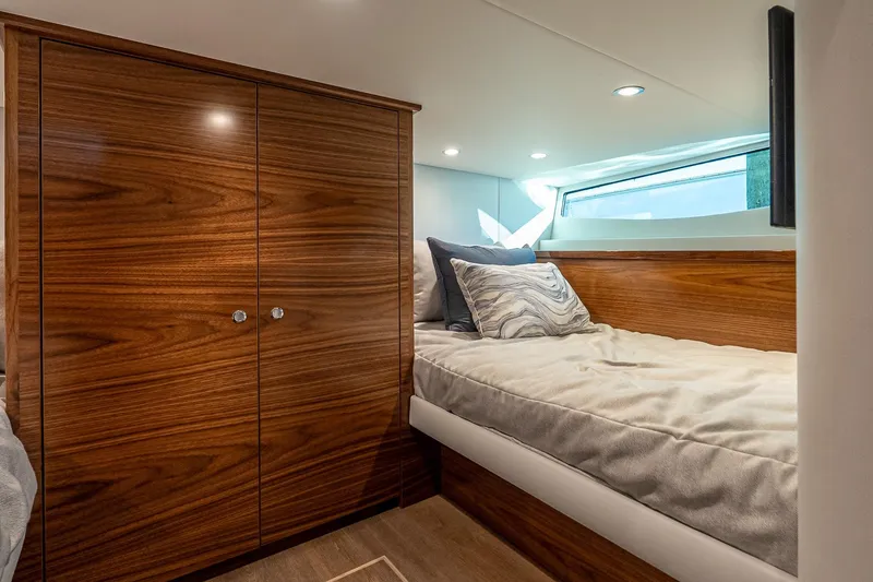 Slide: The Image of Luxurious cabin interior of 2026 Valhalla V-55 Sport Yacht with wood finishes. - 36