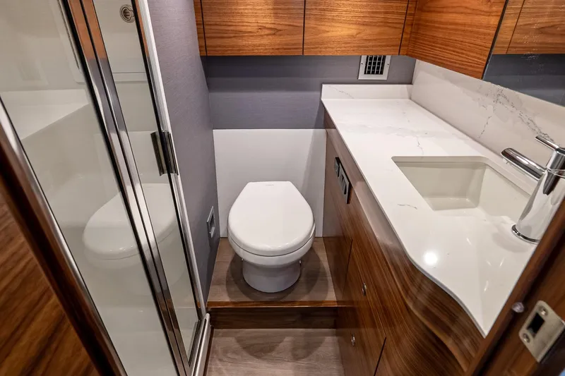 Slide: The Image of Luxurious bathroom in 2026 Valhalla V-55 Sport Yacht with modern fixtures and wood accents. - 38