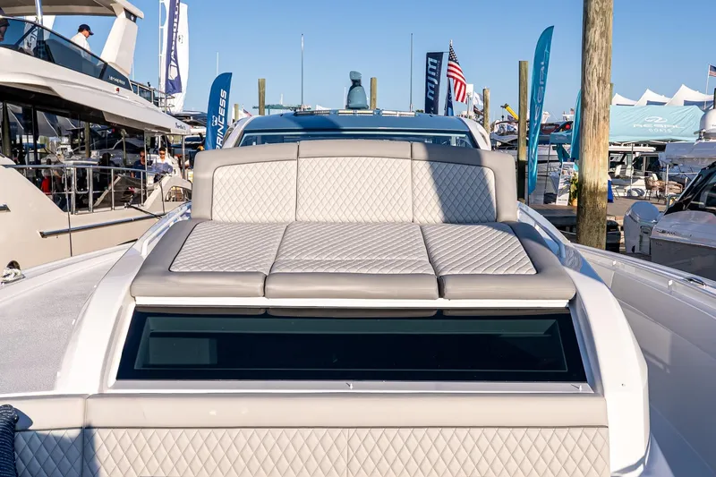 Slide: The Image of 2026 Valhalla V-55 Sport Yacht with luxurious seating at a marina display. - 41