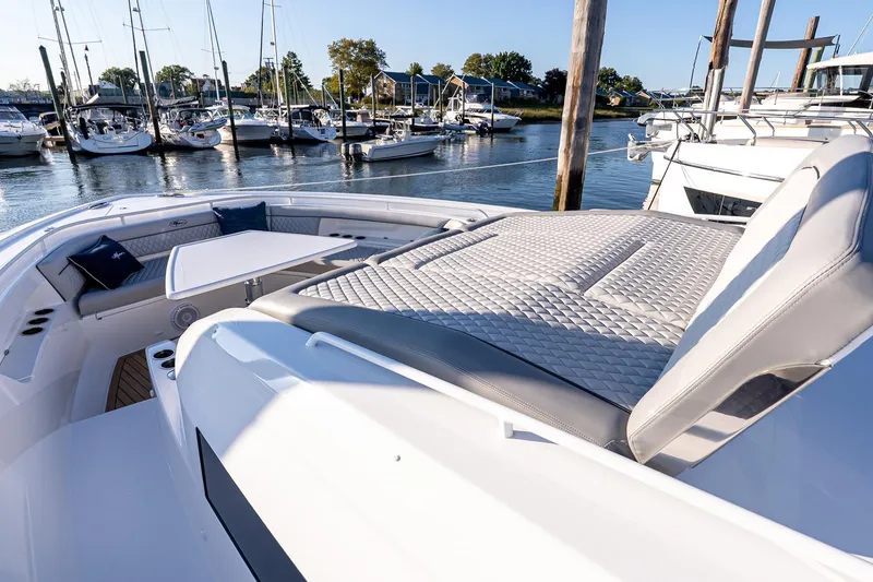 Slide: The Image of 2026 Valhalla V-55 Sport Yacht with luxurious seating and marina view. - 42