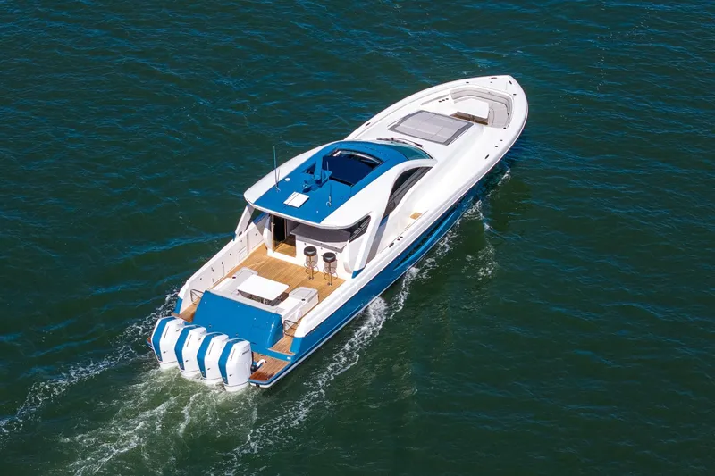 Slide: The Image of 2026 Valhalla Boatworks V-55 Sport Yacht cruising on open water, rear view. - 5