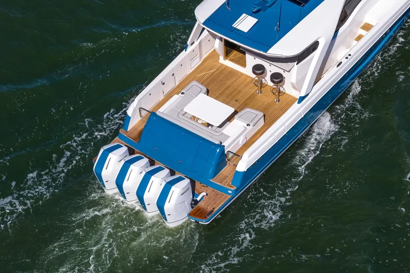 Slide: The Image of 2026 Valhalla Boatworks V-55 Sport Yacht cruising on water, showcasing sleek design and powerful engines. - 6