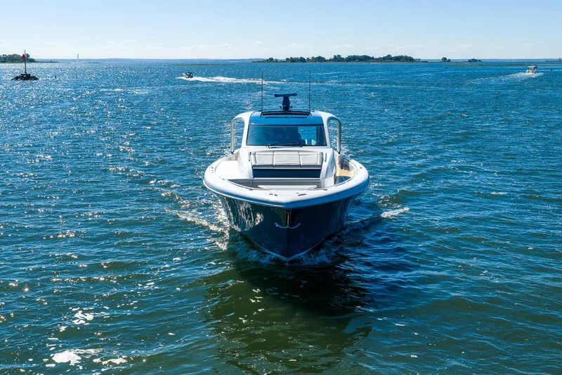 Slide: The Image of 2026 Valhalla Boatworks V-55 Sport Yacht cruising on open water. - 3