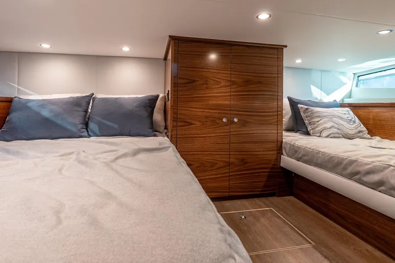 Slide: The Image of Luxurious cabin interior of 2026 Valhalla V-55 Sport Yacht with elegant wood finishes. - 34