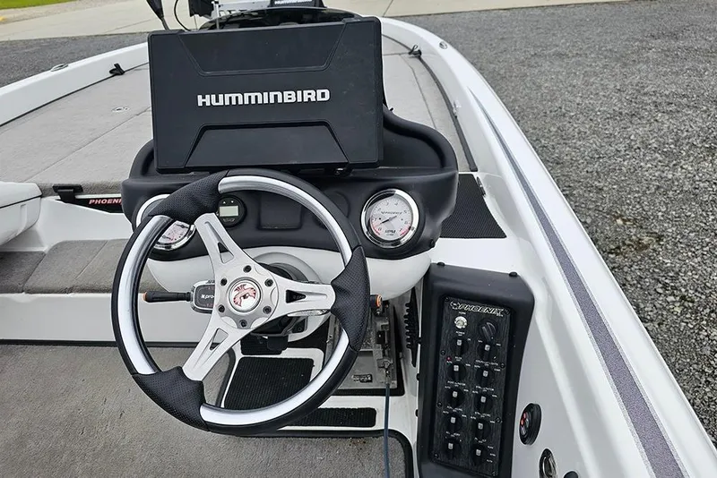 Slide: The Image of 2018 Phoenix 921 ProXP boat dashboard with steering wheel and Humminbird electronics. - 10