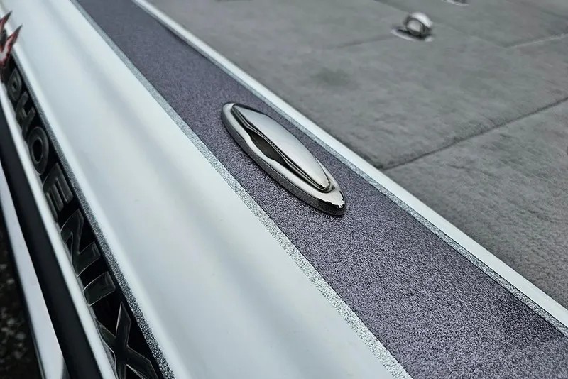 Slide: The Image of Close-up of 2018 Phoenix 921 ProXP boat deck with sleek metallic details. - 16