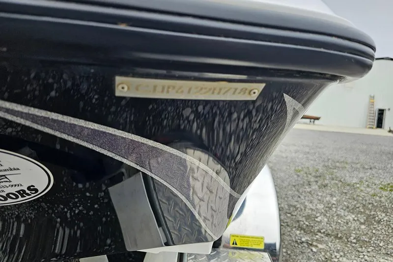 Slide: The Image of 2018 Phoenix 921 ProXP boat hull with visible identification number and decals. - 20